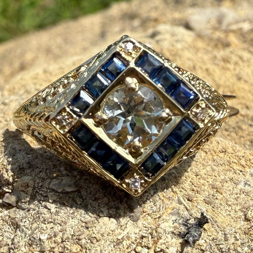 Elegant Gold with a Stunning White Sapphire Ring with Channel Set Blue Sapphires